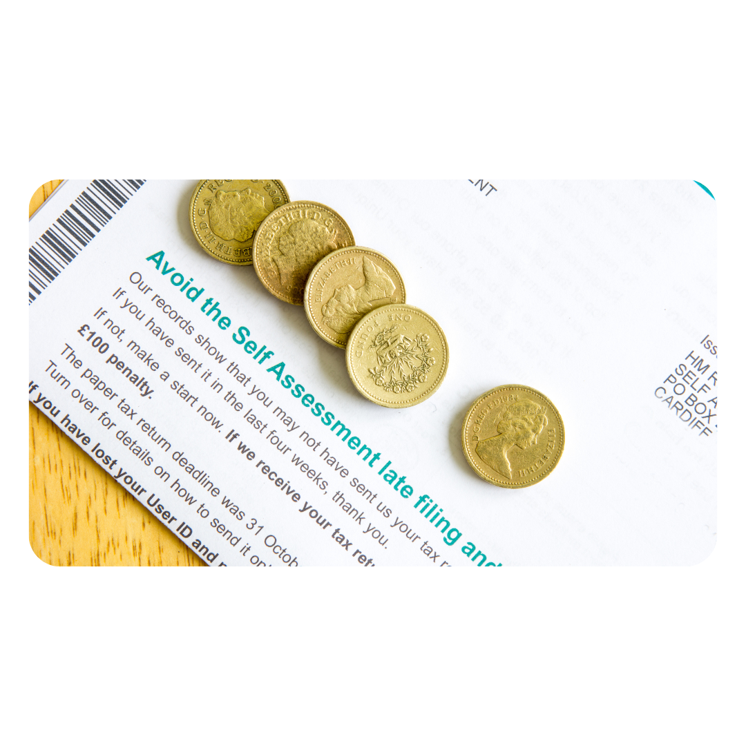 Self Assessment tax form with five-pound coins, symbolising managing tax returns and finances for self-employed individuals.